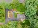 Beautiful home with lush landscaping, mature trees, and a well-maintained lawn from an aerial perspective at 2000 Ferncliff Rd, Charlotte, NC 28211