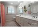The bathroom is bright and roomy, with a long vanity and ample storage, plus a fun accent wall at 2000 Ferncliff Rd, Charlotte, NC 28211