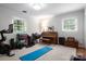 The bonus room offers space for exercise equipment, a piano, and more at 2000 Ferncliff Rd, Charlotte, NC 28211