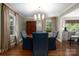 Elegant dining room featuring hardwood floors, and a stylish chandelier, adjacent to the kitchen at 2000 Ferncliff Rd, Charlotte, NC 28211