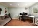 Bright office space with hardwood floors, a comfortable sofa, a workstation and natural light at 2000 Ferncliff Rd, Charlotte, NC 28211