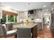 Modern kitchen features granite countertops, stainless steel appliances, island, and hardwood floors at 2000 Ferncliff Rd, Charlotte, NC 28211