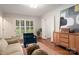 Cozy living room with hardwood floors, large windows, and a mix of modern and traditional furniture at 2000 Ferncliff Rd, Charlotte, NC 28211