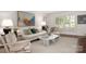 Bright and airy living room featuring neutral decor, and a large window with shutter blinds at 2000 Ferncliff Rd, Charlotte, NC 28211