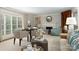 Bright living room with fireplace, neutral decor, and natural light from large windows at 2000 Ferncliff Rd, Charlotte, NC 28211
