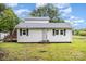 Charming single story home with a covered porch and black shutters on a lush green lawn at 2317 Flint Hill Church Rd, Shelby, NC 28152