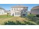 Back of house with yard, patio, grill, and partially covered porch at 2441 Chatham Dr, Fort Mill, SC 29707