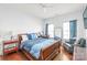Bedroom with natural light, wood floors, a ceiling fan, and a full-size bed at 2441 Chatham Dr, Fort Mill, SC 29707