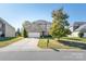 Charming two-story home with a stone accent, driveway and manicured front lawn at 2441 Chatham Dr, Fort Mill, SC 29707