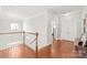 Upstairs hallway with hardwood floors and a chandelier at 2441 Chatham Dr, Fort Mill, SC 29707