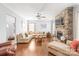 Inviting living room with hardwood floors, a stone fireplace, and a comfortable sectional sofa at 2441 Chatham Dr, Fort Mill, SC 29707