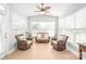 Bright sun room with tiled flooring and ample natural light from the surrounding windows at 2441 Chatham Dr, Fort Mill, SC 29707