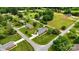 Beautiful aerial view of a brick home on a large lot with mature trees at 301 Museum Rd, Statesville, NC 28625