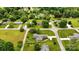 Aerial view features homes with large lots, mature trees and a well-kept lawn at 301 Museum Rd, Statesville, NC 28625