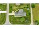 Overhead view features a large lot with mature landscaping, garden and brick home at 301 Museum Rd, Statesville, NC 28625
