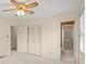 Bedroom with louvered closet doors and an ensuite bathroom at 301 Museum Rd, Statesville, NC 28625