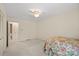 This cozy bedroom boasts neutral carpet and an ensuite bathroom at 301 Museum Rd, Statesville, NC 28625