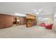 Large bonus room featuring a wet bar area, ample seating, and natural light at 301 Museum Rd, Statesville, NC 28625
