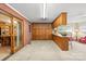 Versatile bonus room with abundant cabinet space, a wet bar, and seamless access to the outdoors at 301 Museum Rd, Statesville, NC 28625