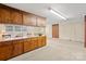 Large bonus room offering ample cabinet space, a wet bar, and views of the backyard at 301 Museum Rd, Statesville, NC 28625