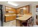 The functional kitchen features wood cabinets, stainless steel appliances, and a convenient breakfast bar at 301 Museum Rd, Statesville, NC 28625