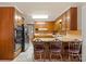 The kitchen boasts ample wood cabinets and a breakfast bar with seating, perfect for casual dining at 301 Museum Rd, Statesville, NC 28625