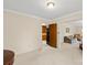 Open living room, featuring light walls and carpet and access to other rooms in the home at 301 Museum Rd, Statesville, NC 28625