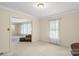 Large living room featuring access to other rooms and neutral colored walls and carpet at 301 Museum Rd, Statesville, NC 28625