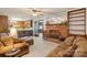 Cozy living room featuring a brick fireplace and access to the kitchen, blending comfort and functionality at 301 Museum Rd, Statesville, NC 28625
