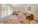 Bright living room featuring a decorative rug, neutral paint, and comfortable seating at 301 Museum Rd, Statesville, NC 28625