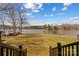Lush backyard view with a lake and private boat dock. Stairs provide easy access at 3062 Bass Dr, Sherrills Ford, NC 28673