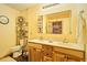 Bathroom features a double vanity with wooden cabinets and framed mirrors at 3062 Bass Dr, Sherrills Ford, NC 28673