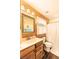 Well-lit bathroom featuring a vanity, mirror, and shower at 3062 Bass Dr, Sherrills Ford, NC 28673
