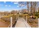 Lakefront property showcasing a private dock with an American flag waving in the breeze at 3062 Bass Dr, Sherrills Ford, NC 28673