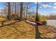 Scenic lakeside with boats, storage shed, and serene water access in a quiet setting at 3062 Bass Dr, Sherrills Ford, NC 28673