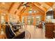Vaulted great room boasts wood finishes, fireplace, and sliding glass doors to the balcony with lovely lake views at 3062 Bass Dr, Sherrills Ford, NC 28673
