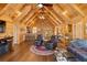 Open-concept living area with wood finishes, fireplace, ceiling fans, and adjacent dining and kitchen spaces at 3062 Bass Dr, Sherrills Ford, NC 28673