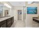 Bright bathroom features double sinks, granite countertops, a glass shower, and a separate vanity area at 3537 Plum St, Fort Mill, SC 29715