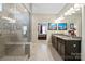 Bright bathroom with double vanities, granite countertop, tile floors, and walk-in shower with glass enclosure at 3537 Plum St, Fort Mill, SC 29715