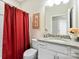 Cozy bathroom features a granite countertop and stylish red shower curtain at 3537 Plum St, Fort Mill, SC 29715