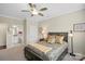 Comfortable bedroom with a plush bed, soft lighting, and a door leading into the bathroom at 3537 Plum St, Fort Mill, SC 29715