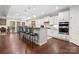 Bright, open kitchen with a large island, white cabinets, and pendant lighting at 3537 Plum St, Fort Mill, SC 29715