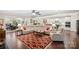 Open concept living space with hardwood floors connecting the living room, dining area, and kitchen at 3537 Plum St, Fort Mill, SC 29715