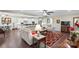 Open concept living space with hardwood floors connecting the living room, dining area, and kitchen at 3537 Plum St, Fort Mill, SC 29715