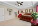 Spacious main bedroom with a tray ceiling, carpet flooring, and an ensuite bathroom at 3537 Plum St, Fort Mill, SC 29715