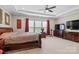 Spacious main bedroom with tray ceiling, plush carpet, and ample natural light from large windows at 3537 Plum St, Fort Mill, SC 29715