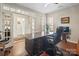 Comfortable home office with a large desk, hardwood floors, and bright windows at 3537 Plum St, Fort Mill, SC 29715