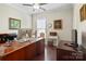 Bright home office with hardwood floors, built-in desk, and modern decor at 3537 Plum St, Fort Mill, SC 29715