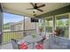 Relaxing screened porch equipped with seating and a mounted television at 3537 Plum St, Fort Mill, SC 29715