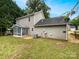 Back exterior featuring a sunroom at 3600 Sipes Ln, Charlotte, NC 28269